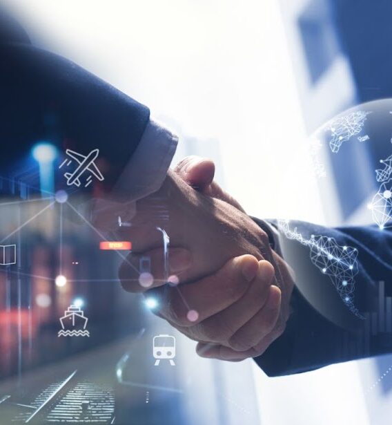 Two men shaking hands with technological overlay—Trackonomy